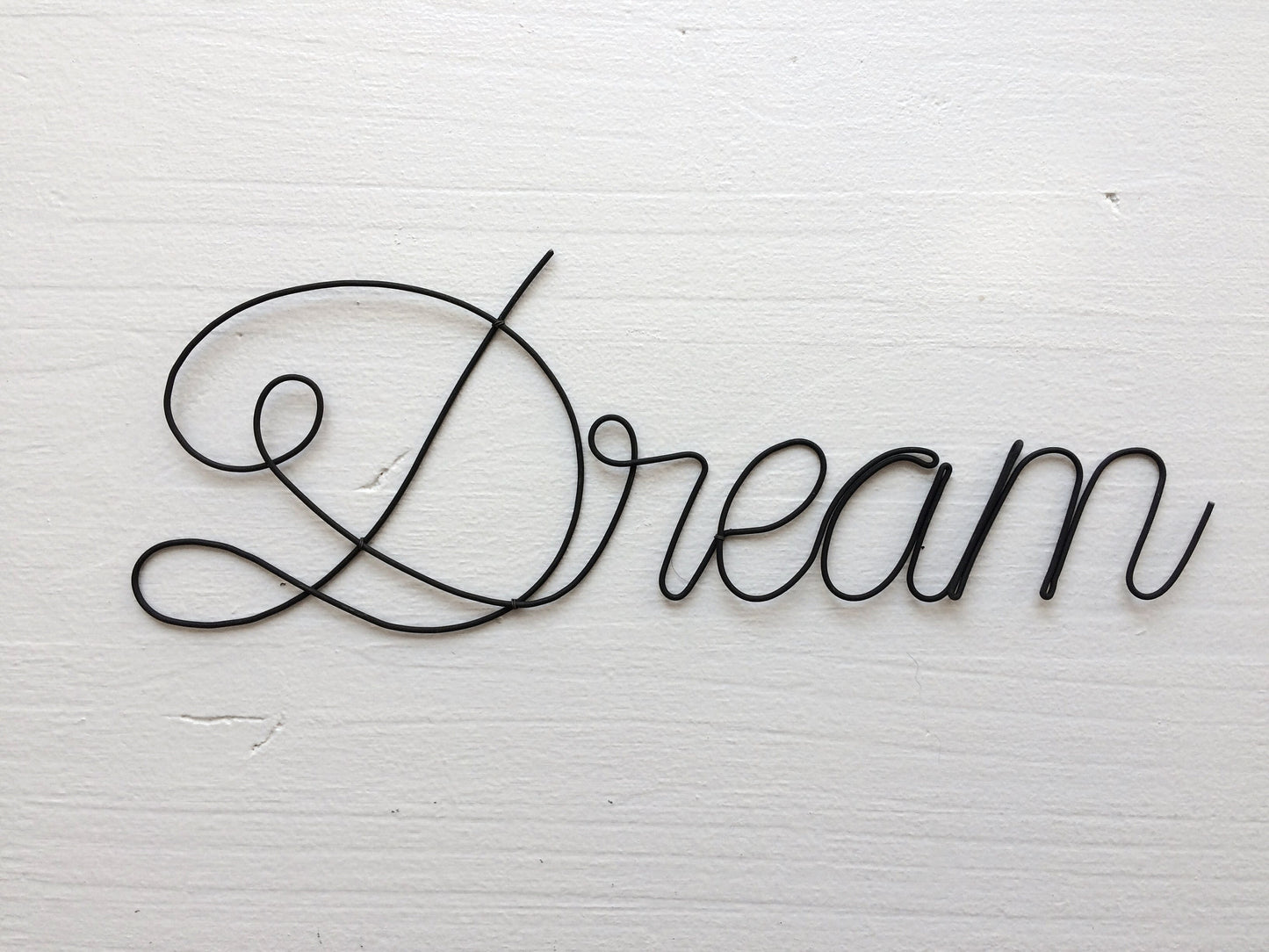 Dream door plaque in annealed wire, word in wire, message, sentence, quote, sculpture in annealed wire, baby room