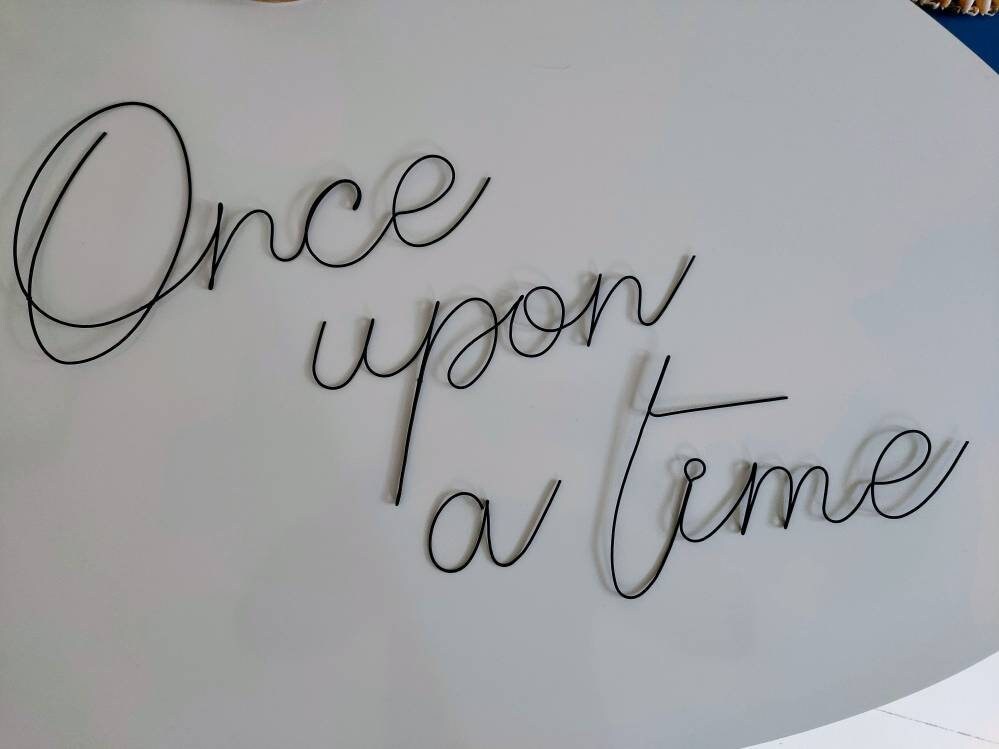 Phrase Once upon a time in annealed wire, writing, wire message, wire phrase, wire quote, wire wall decor